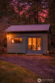 a view of a livingroom with furniture and staircase