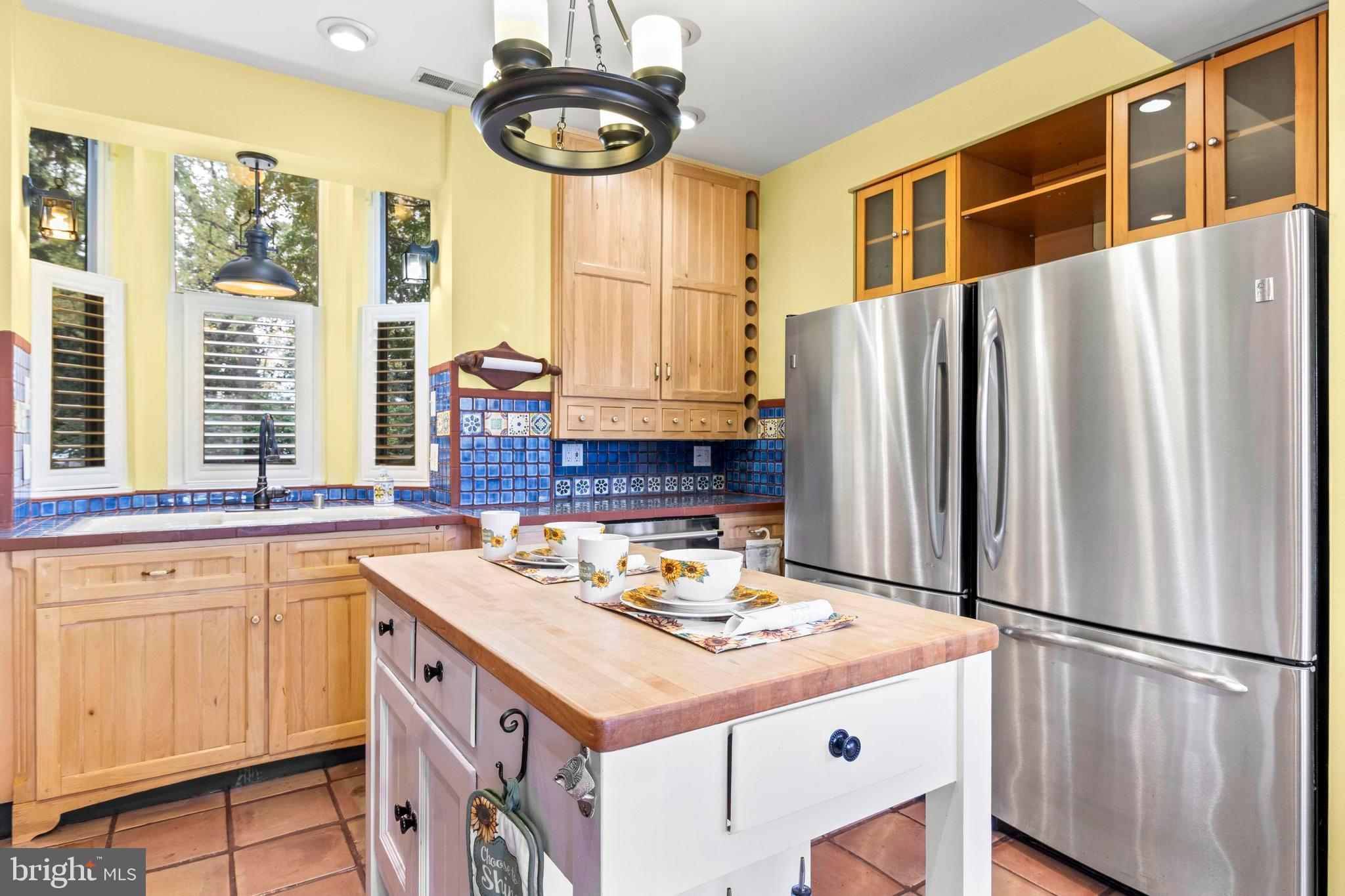 12330 Potomac View Road Newburg, MD 20664 - Photo 24 of 85 a kitchen with a refrigerator a stove a sink and a window