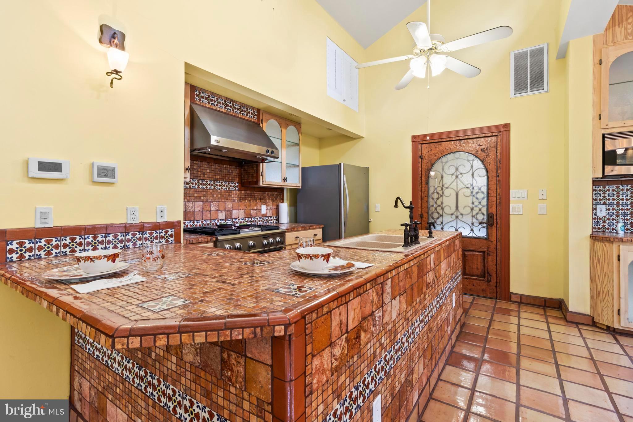 12330 Potomac View Road Newburg, MD 20664 - Photo 67 of 85 a dining hall with stainless steel appliances granite countertop a dining table and chairs with wooden floor