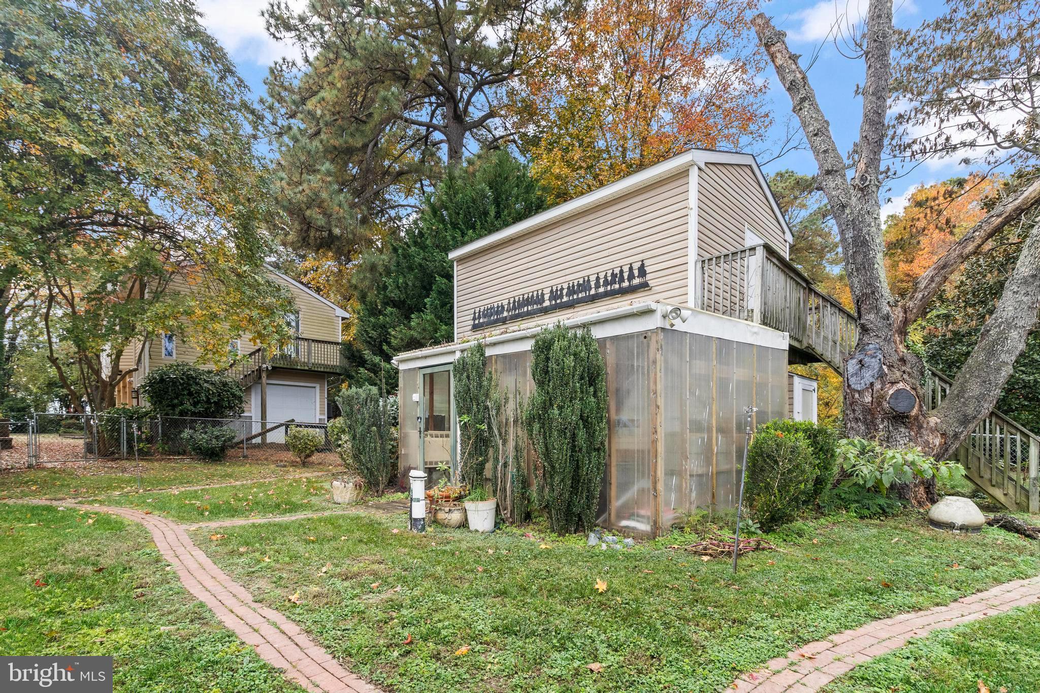 12330 Potomac View Road Newburg, MD 20664 - Photo 73 of 85 a view of a white house with a big yard and large trees