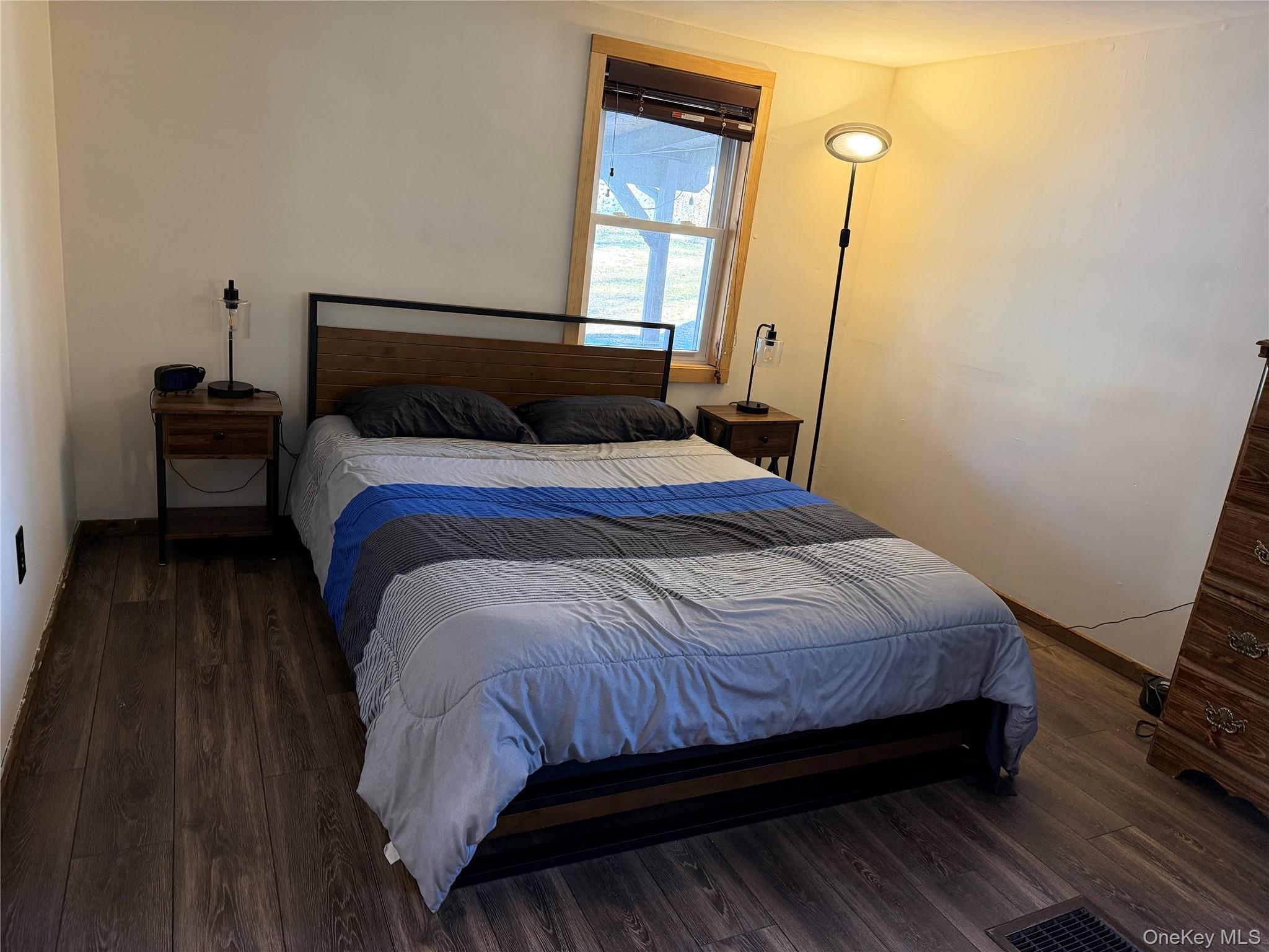 302 Lake Road New Windsor, NY 12553 - Photo 14 of 24 a bed sitting in a bedroom next to a window