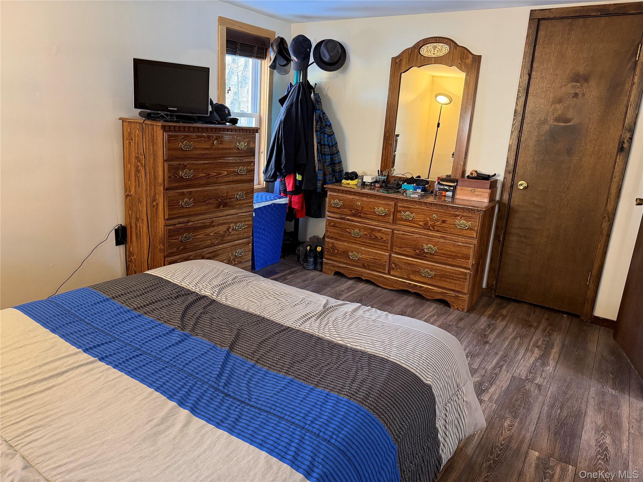 302 Lake Road New Windsor, NY 12553 - Photo 15 of 24 a bedroom with a bed and a flat tv screen on dresser