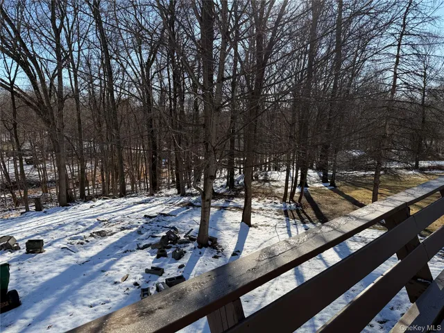a view of a building with trees on a road