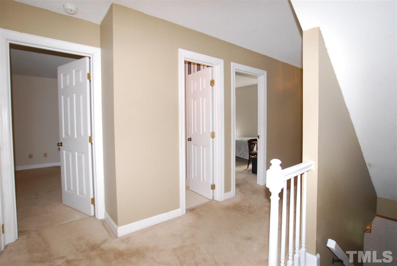 3313 Horseshoe Bend Raleigh, NC 27613 - Photo 15 of 25 a view of a hallway with closet and livingroom