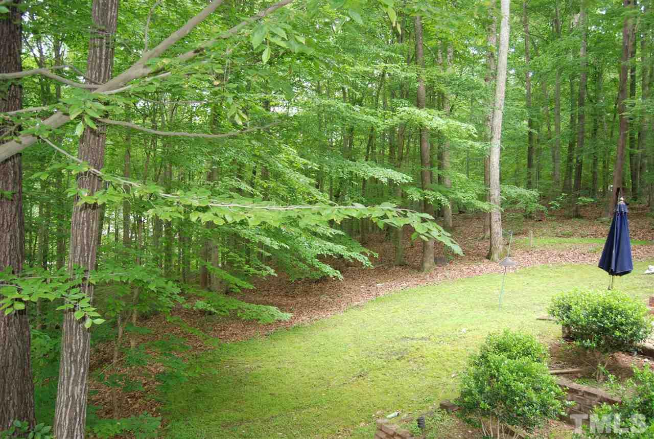 3313 Horseshoe Bend Raleigh, NC 27613 - Photo 25 of 25 a backyard of a house with lots of green space