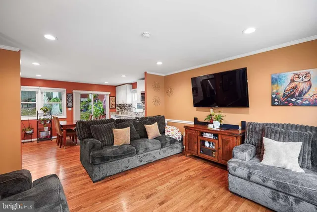 a living room with fireplace furniture and a flat screen tv