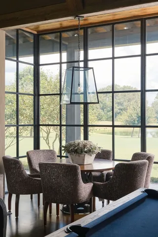 a view of a house with backyard and porch