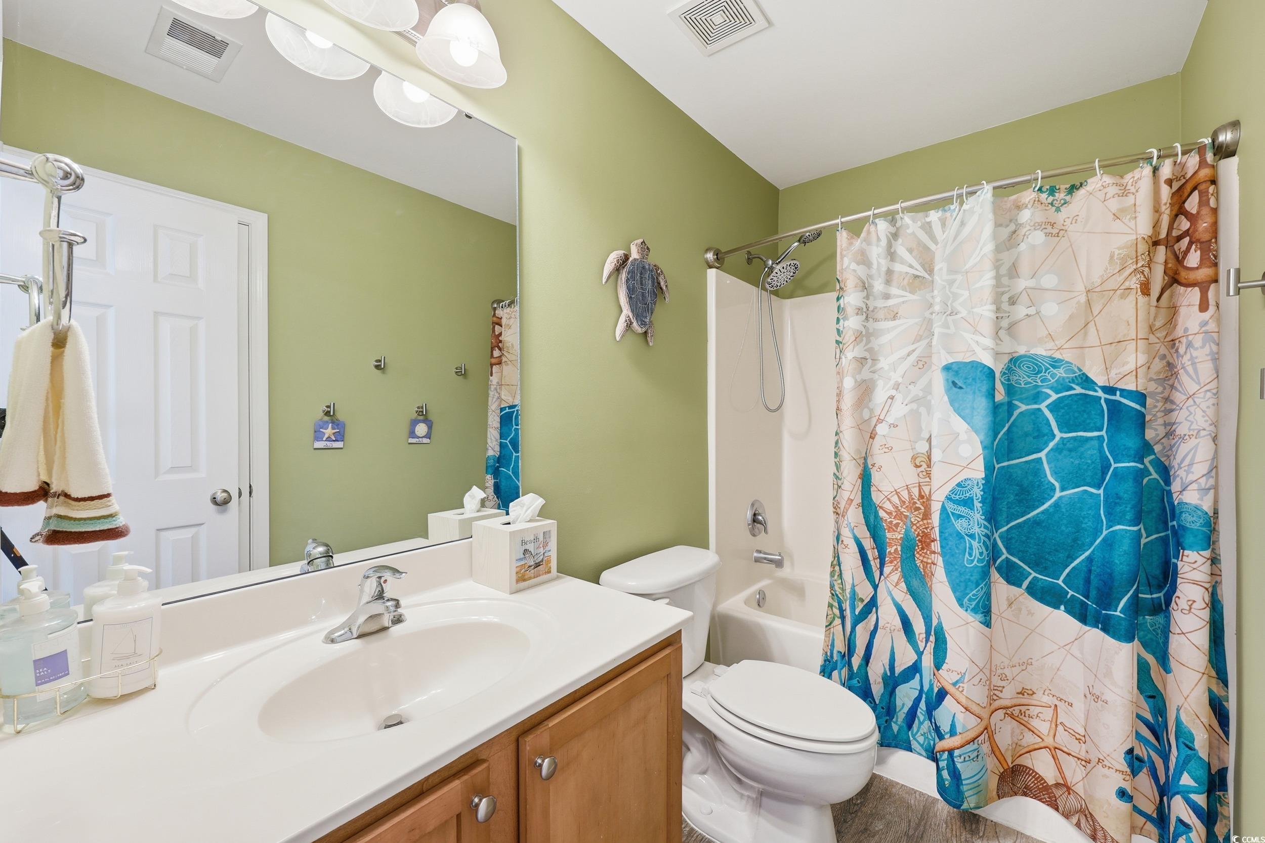 236 Devonbrook Place Longs, SC 29568 - Photo 19 of 40 Full bathroom with shower / tub combo with curtain and vanity