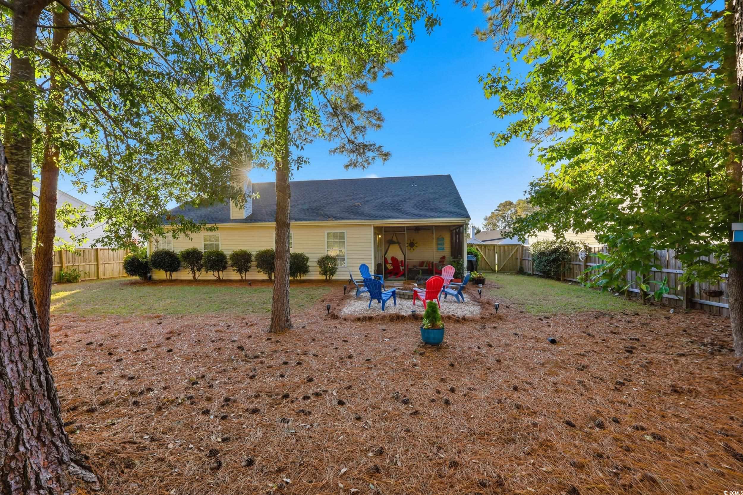 236 Devonbrook Place Longs, SC 29568 - Photo 35 of 40 Back of property featuring a fenced backyard, a patio area, and a sunroom