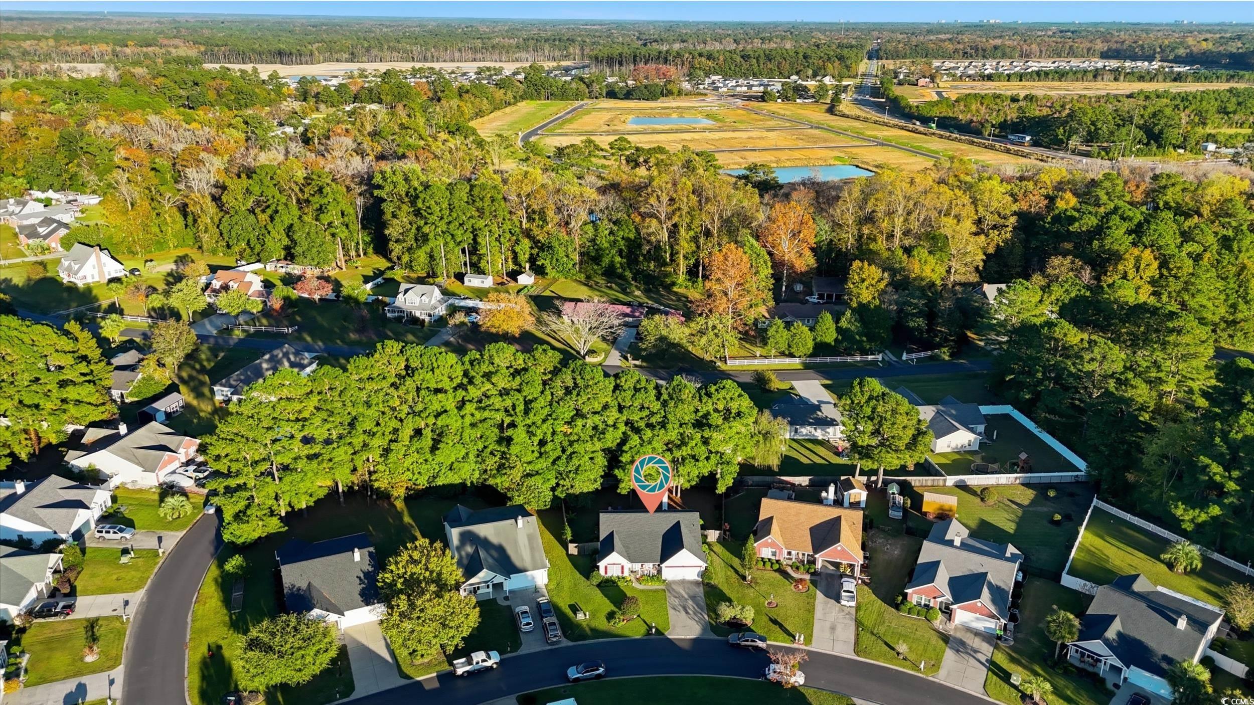 236 Devonbrook Place Longs, SC 29568 - Photo 39 of 40 Aerial view of property and surrounding area featuring nearby suburban area and a forest