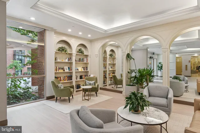 a view of a livingroom with furniture and garden view