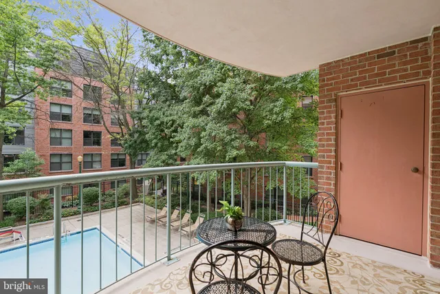 a view of a balcony with chairs