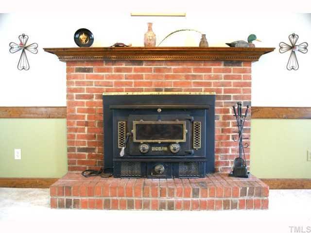 3201 Greenville Loop Road Wake Forest, NC 27587 - Photo 5 of 9 Wonderfully useful wood stove insert with blower! Will definitely crank out the heat!