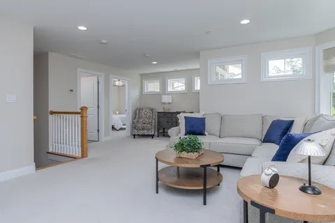 a living room with furniture and a table