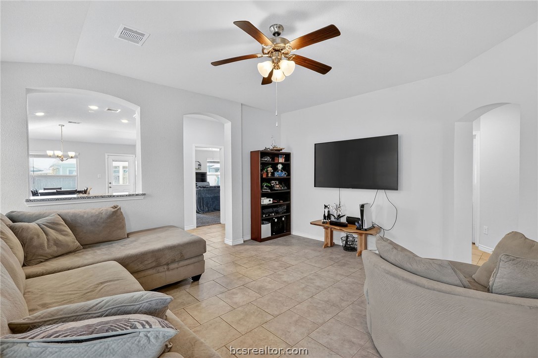 5235 Montague Loop Bryan, TX 77807 - Photo 5 of 25 a living room with furniture and a flat screen tv