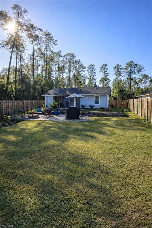 4121 8th Avenue Southeast Naples, FL 34117 - Photo 2 of 10 a view of a house with a yard and sitting area