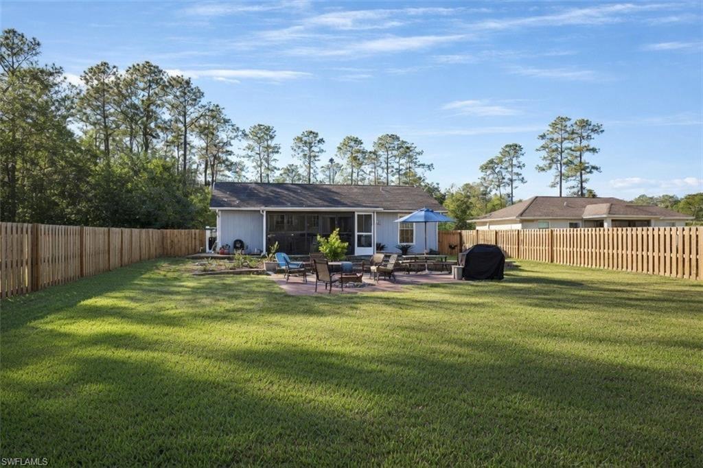 4121 8th Avenue Southeast Naples, FL 34117 - Photo 3 of 10 a view of a house with backyard porch and sitting area