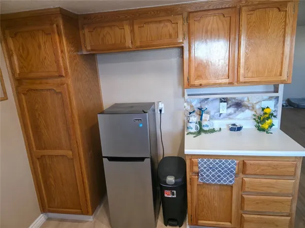 a white refrigerator freezer sitting inside of a kitchen