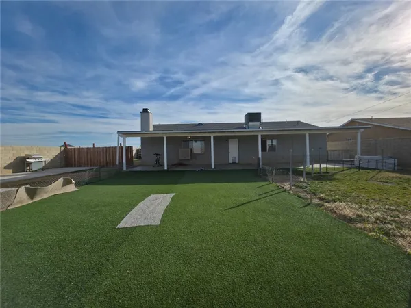 a view of a house with a back yard
