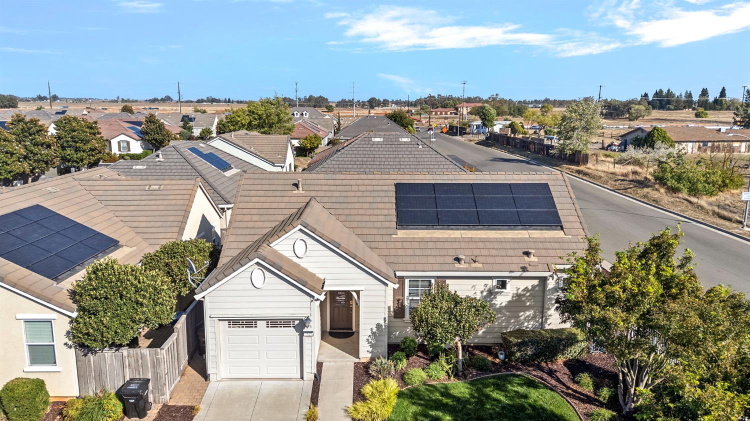 7525 Eldred Way Sacramento, CA 95829 - Photo 23 of 32 a view of a white house next to a yard