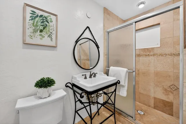 a dining room with a table and a mirror