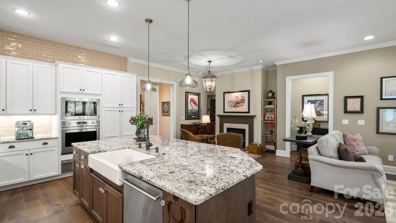 4854 Looking Glass Trail Denver, NC 28037 - Photo 13 of 48 a kitchen with stainless steel appliances granite countertop a kitchen island a stove and a sink