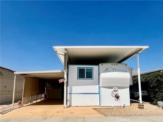a view of a patio with table and chairs