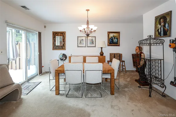 a dining room with furniture and window