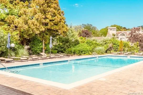 a view of a swimming pool and a yard
