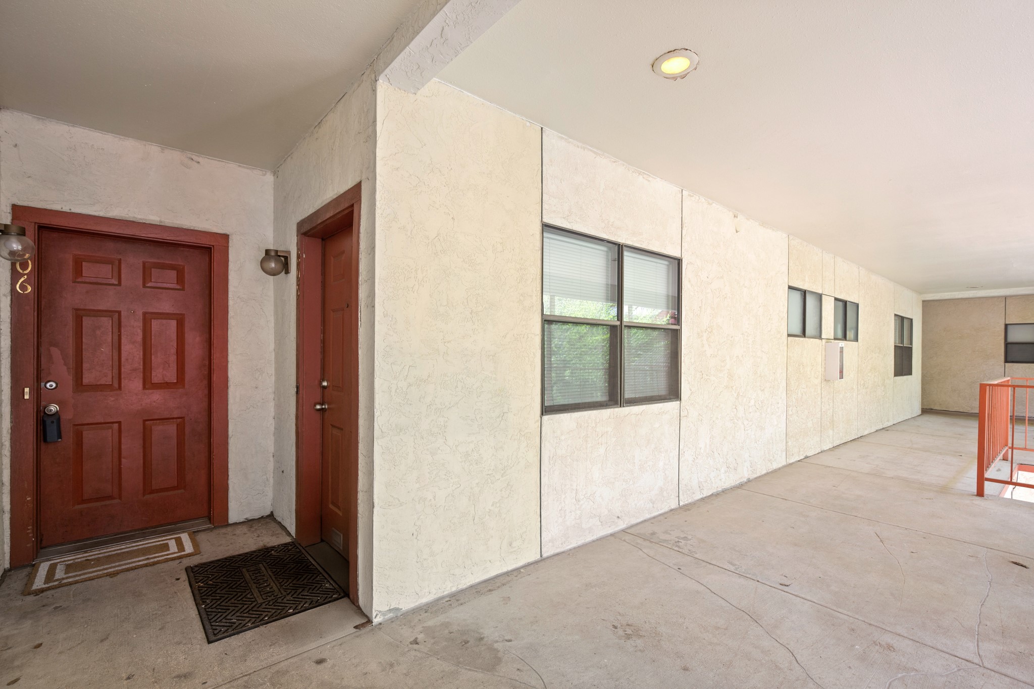 706 West 22nd Street, Unit 206 Austin, TX 78705 - Photo 15 of 18 Doorway to property with stucco siding