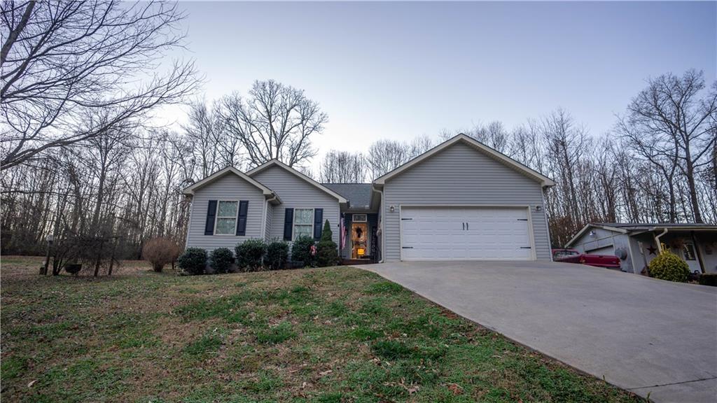 121 Cain Bridge Meadows Road Demorest, GA 30535 - Photo 1 of 1 a front view of house with yard and trees