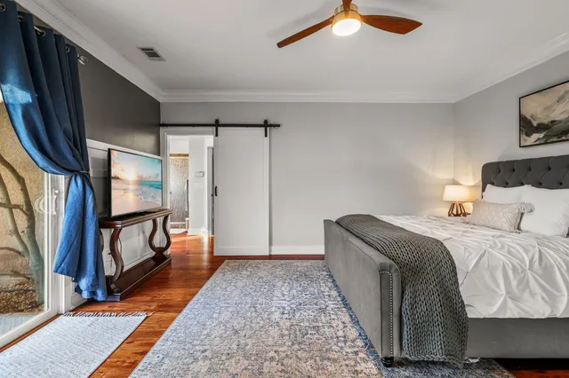a bathroom with a shower and a sink