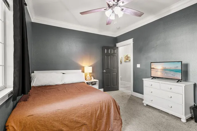 a bathroom with a granite countertop sink a toilet and a mirror