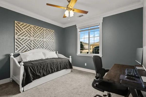a bathroom with a granite countertop sink a toilet and a mirror