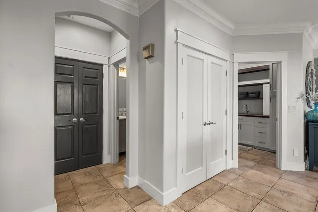 a view of a patio with table and chairs and potted plants