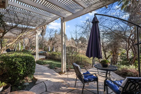 a view of a backyard with sitting area