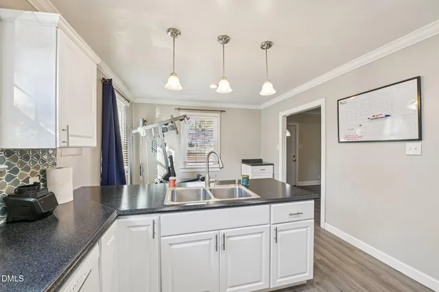 a kitchen with sink and window