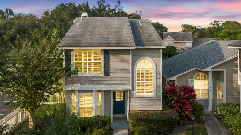 949 Tillery Way, Unit 101 Orlando, FL 32828 - Photo 1 of 38 a aerial view of a house with a garden