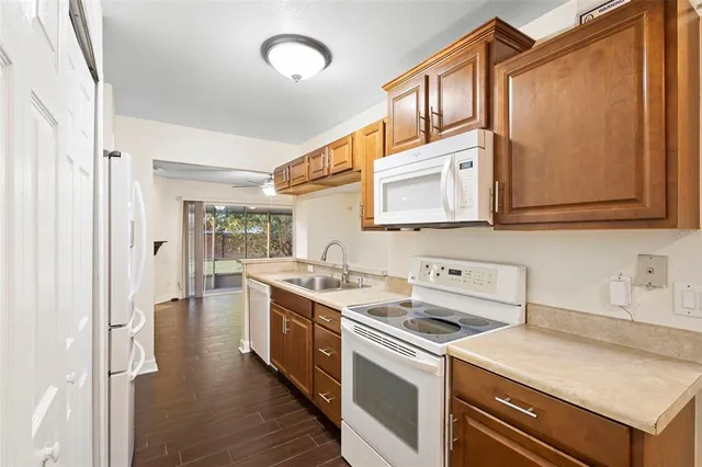 a kitchen with stainless steel appliances granite countertop a stove and a sink