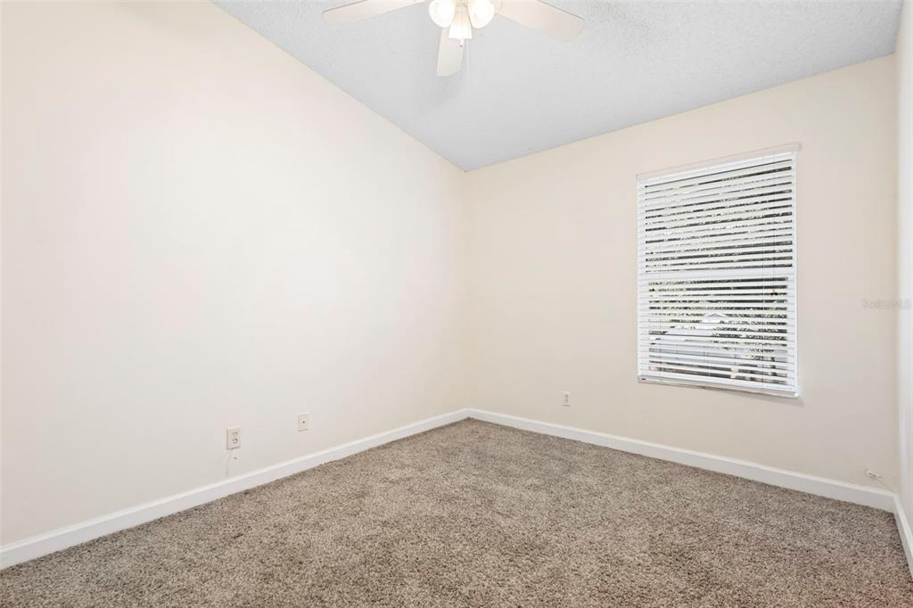 949 Tillery Way, Unit 101 Orlando, FL 32828 - Photo 16 of 38 an empty room with a window