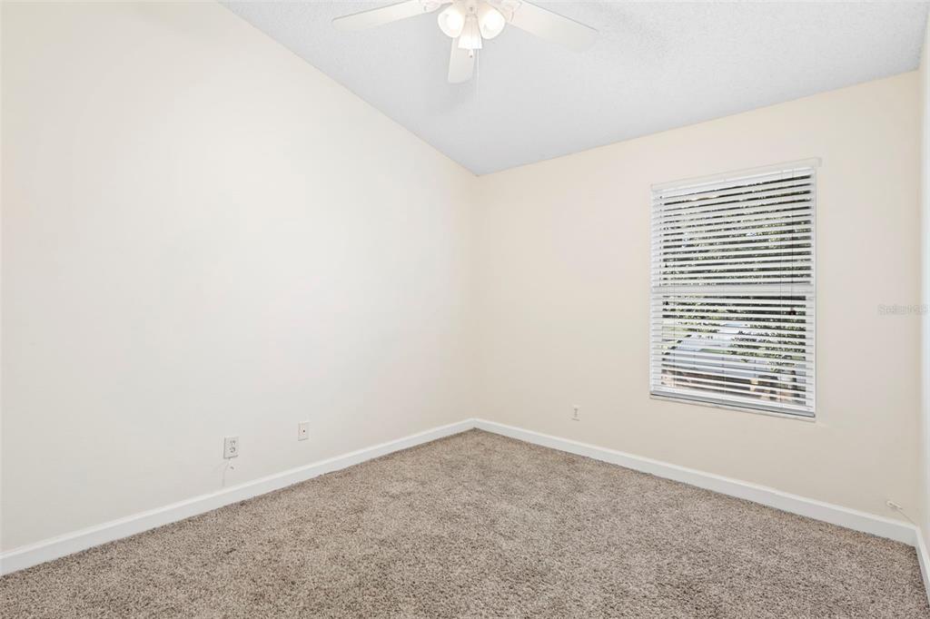 949 Tillery Way, Unit 101 Orlando, FL 32828 - Photo 18 of 38 an empty room with a window