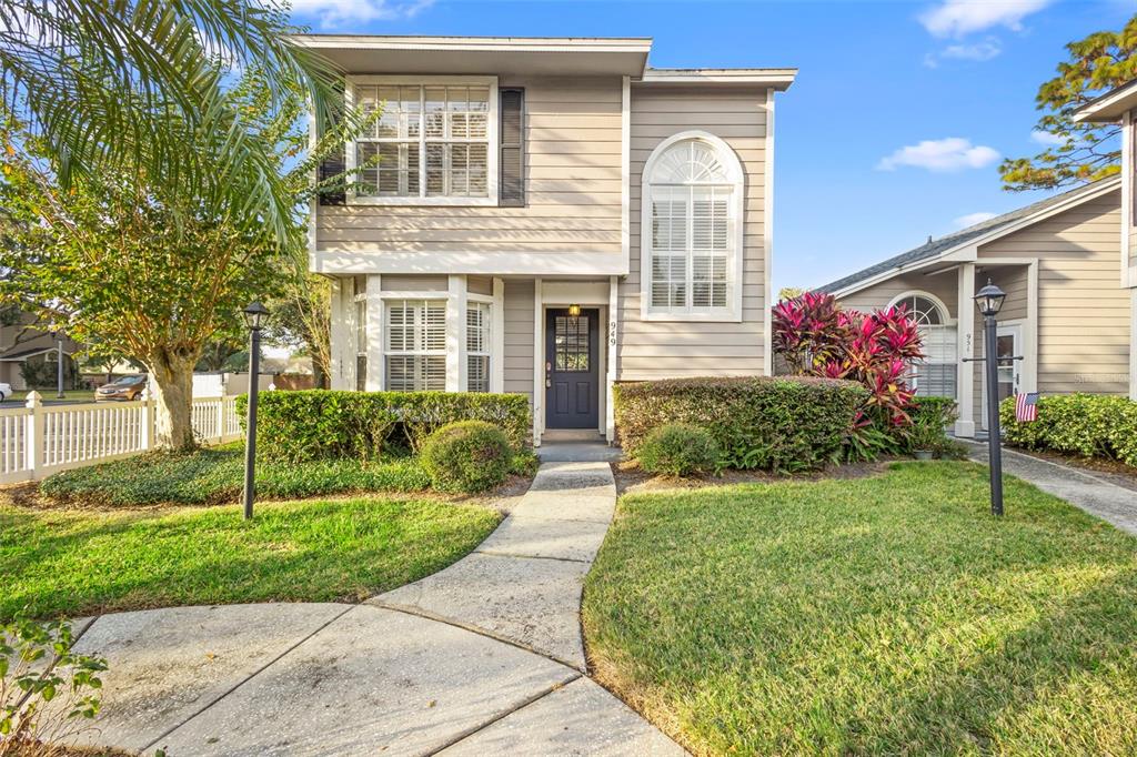 949 Tillery Way, Unit 101 Orlando, FL 32828 - Photo 2 of 38 a front view of house with yard