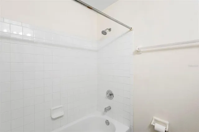 a bathroom with a shower and a bathtub