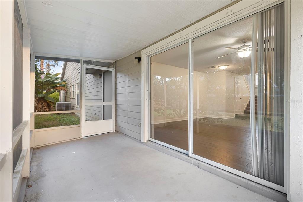 949 Tillery Way, Unit 101 Orlando, FL 32828 - Photo 28 of 38 a view of empty room with window and ceiling fan