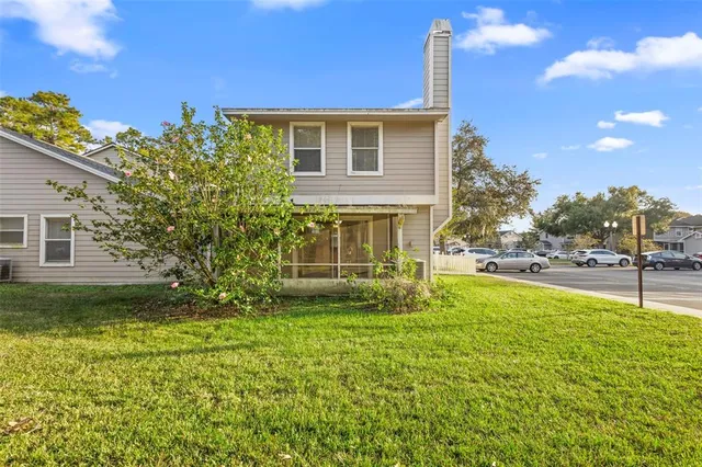 a view of a house with a yard