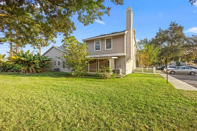 a view of a house with a yard