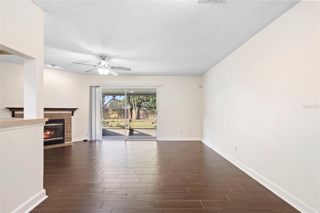 949 Tillery Way, Unit 101 Orlando, FL 32828 - Photo 6 of 38 a view of an empty room with a window and fireplace