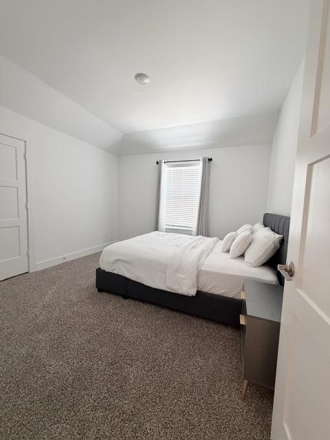 13725 Rising Sun Lane Conroe, TX 77384 - Photo 22 of 29 a bedroom with a bed and a mirror
