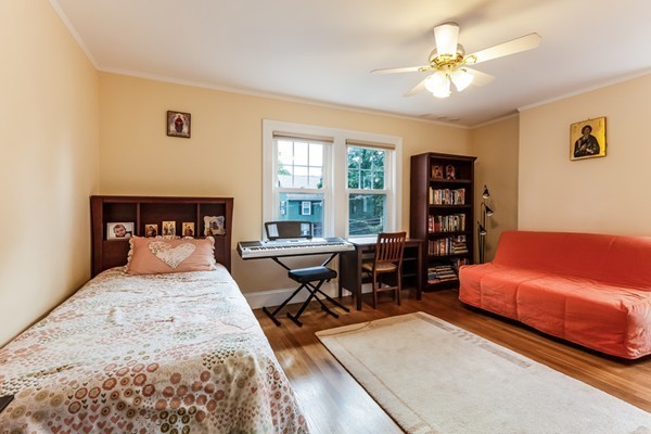 104 Cutter Hill Road Arlington, MA 02474 - Photo 13 of 19 a bedroom with a bed a table and chair