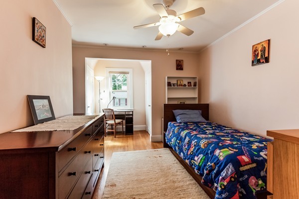 104 Cutter Hill Road Arlington, MA 02474 - Photo 14 of 19 a bedroom with a bed and wooden floor